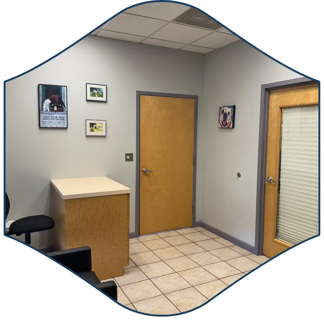 an office with a desk and chairs in front of a door